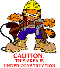 a picture of garfield dressed as a construction working reading 'caution! this area is under construction'.